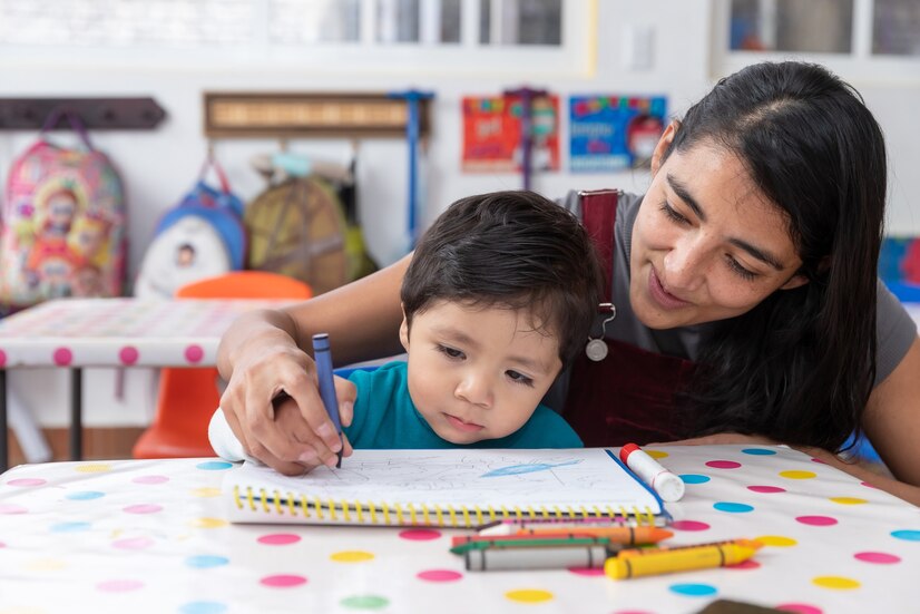 young-mexican-woman-teacher-child-kindergarten-classroom-preschool-education-concept_79390-1625